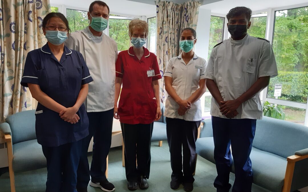 Five people in nursing uniforms
